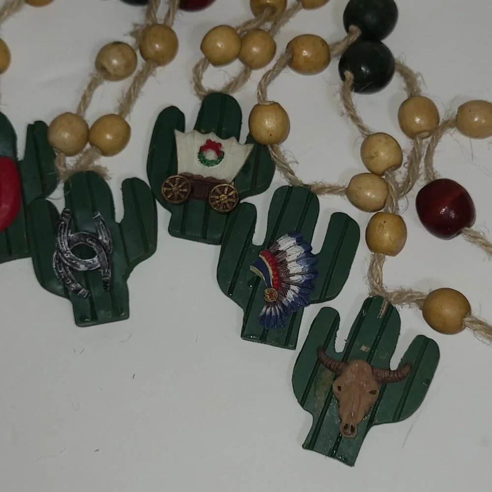 Vintage resin cactus western Christmas garland. Approximately 85 inches long